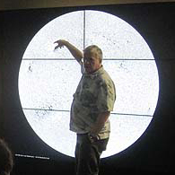 photo of visualization scientist horace mitchell in front of nasa hyperwall