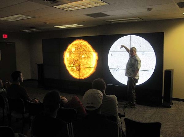nasa goddard sciewntist horace mitchell gives public talk in front of nasa hyperwall